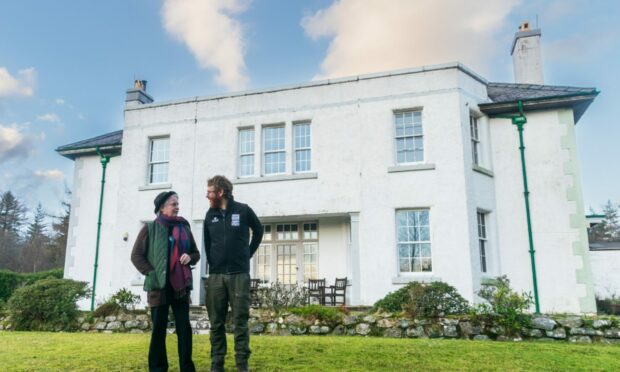 Kathryn Rae and Malcolm Turner outside Couldoran House. Wester Ross. Image: Caz Austin/WTML