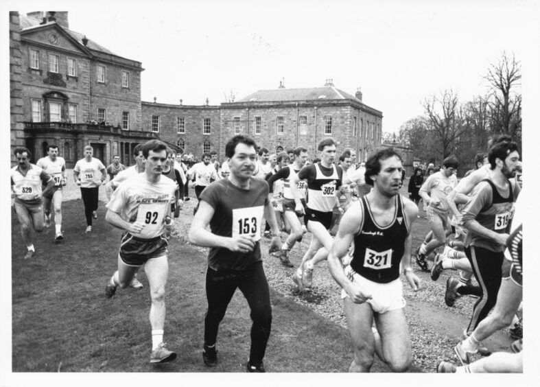 A large group of men running away from Haddo House