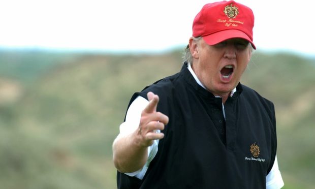 Former US president Donald Trump during a visit to the family's Aberdeenshire golf course, which accounts show a tenth consecutive loss. Image: HEMEDIA