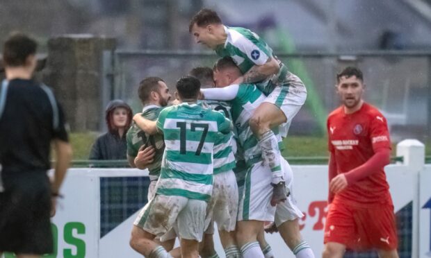 Buckie Thistle players celebrate scoring against Brora Rangers