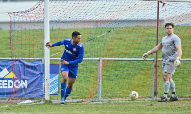 Fraser Forbes, left, celebrates after scoring Lossiemouth's second goal against Keith. Pictures by Jason Hedges