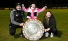 Fraserburgh manager Mark Cowie and daughters Emma and Lily with the Morrison Motors (Turriff) Aberdeenshire Shield. Pictures by Kenny Elrick
