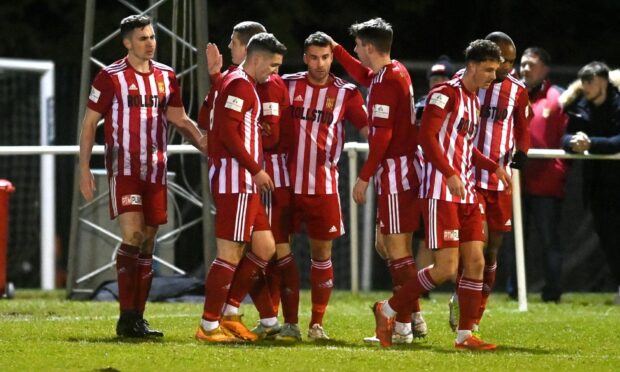 Formartine United's players celebrate their first goal against Brechin City, which was scored by Paul Campbell, left. Pictures by Kenny Elrick