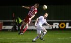 Formartine United's Stuart Smith, left, wins a header against Marc Scott of Brechin City. Pictures by Kenny Elrick
