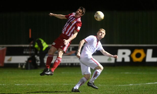 Formartine United's Stuart Smith, left, wins a header against Marc Scott of Brechin City. Pictures by Kenny Elrick