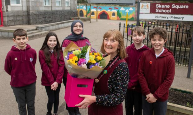 Depute Head Teacher Belinda Findlay said goodbye to pupils at Skene Square Primary School after 34 years. She is pictured with pupils, from left, Joe Murray, Iona Birse-Macqueen, Noor Bashan, Adam Foster and Magnus Hilton. Image: Kath Flannery/DC Thomson