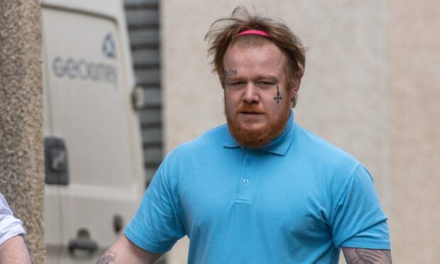 Grant MacFarlane leaving court in custody. Image: DC Thomson