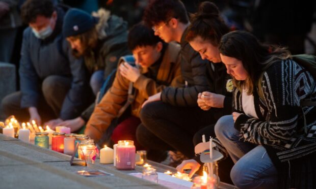Around 200 people attended the vigil for teenager Brianna Ghey in Aberdeen, lighting a candle in memory of her life. Image: Kami Thomson/DC Thomson.