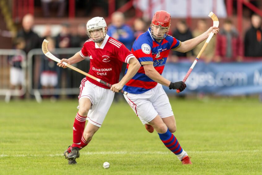 Zander Michie, of Kingussie, and WD Macrae of Kinlochshiel go shoulder-to-shoulder.