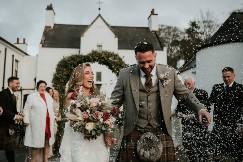 Couple celebrating their wedding at Maryculter House in Aberdeen