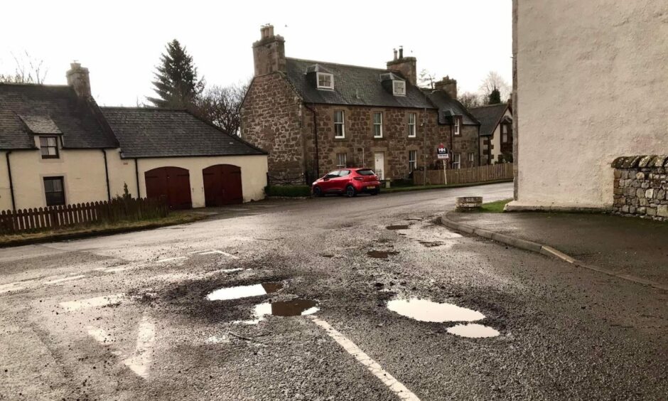 Potholes on Milton Village where Stagecoach said they weren't coming to