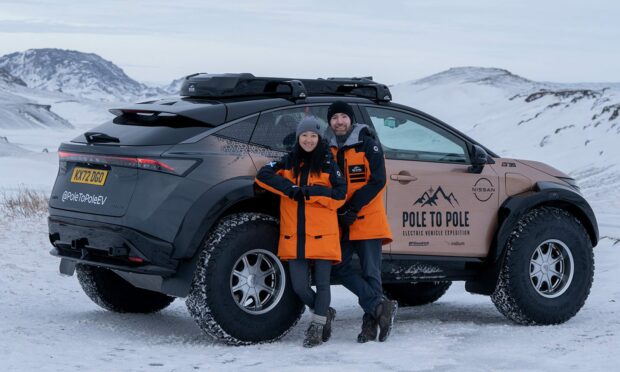 Chris and Julie Ramsey from Bridge of Don, and the electric vehicle they're preparing to drive for 17,000 miles from the magnetic north pole all the way to the south pole. Image: Chris Ramsey.