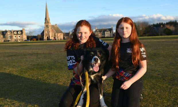 Erin and Abbie Laing with their dog Buck competing at Crufts next month. Image: Paul Glendell / DC Thomson