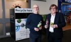 Waste officer at NHS Grampian Neil Duncan and board sustainability champion at NHS Grampian Derick Murray with the reverse vending machine at ARI. Image: Darrell Benns/ DC Thomson.