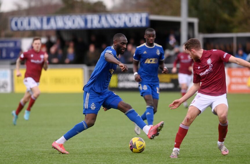 Cove Rangers' Gime Touré takes on Arbroath defender Lewis Banks. Image: Darrell Benns/DC Thomson