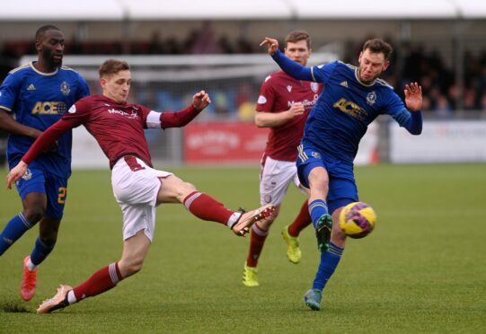 The two skippers, Arbroath's Thomas O'Brien and Cove Rangers' Mitch Megginson, clash. Image: Darrell Benns/DC Thomson