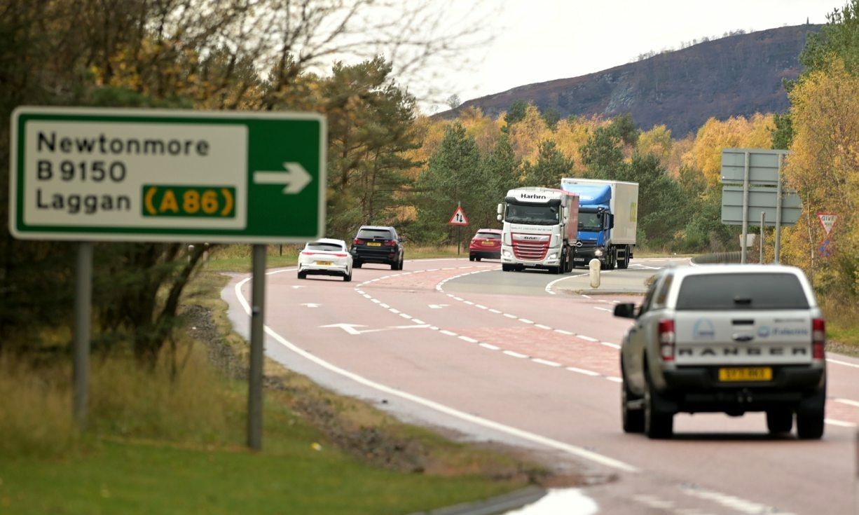 Cars and trucks driving along the A9.
