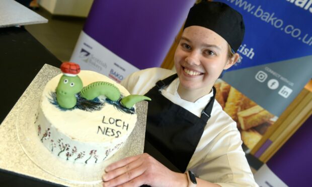 Tetiana Potapko, who fled Ukraine with her family last year with her winning entry of the Loch Ness monster. Image:
Sandy McCook/DC Thomson