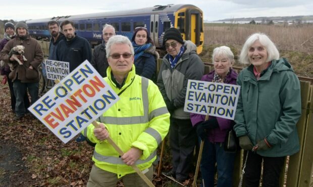Campaigners with placards at Evanton Railway Station