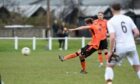 Allen Mackenzie scores Rothes' second goal in their win over Forres Mechanics. Pictures by Sandy McCook/DCT Media