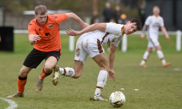 Aidan Sopel, left, in action for Rothes. Image: Sandy McCook/DC Thomson