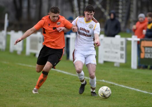 Ryan MacLeman, right, in action for Forres Mechanics. Image: Sandy McCook/DC Thomson