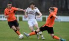 Connall Ewan in action for Forres Mechanics against Rothes. Image: Sandy McCook/DC Thomson