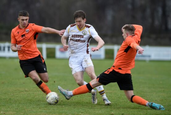 Connall Ewan in action for Forres Mechanics against Rothes. Image: Sandy McCook/DC Thomson