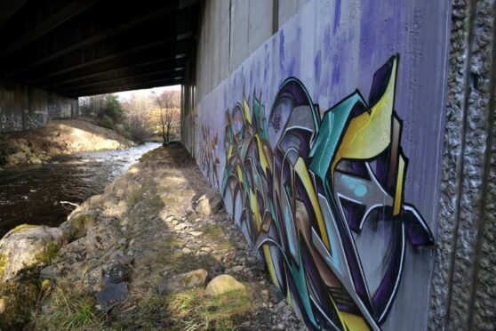Graffiti on the abutments of the A9 bridge as it crosses the River Nairn at Daviot south of Inverness. Image: Sandy McCook/DC Thomson.