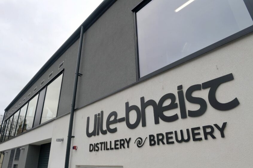Uile-bheist distillery and brewery sign