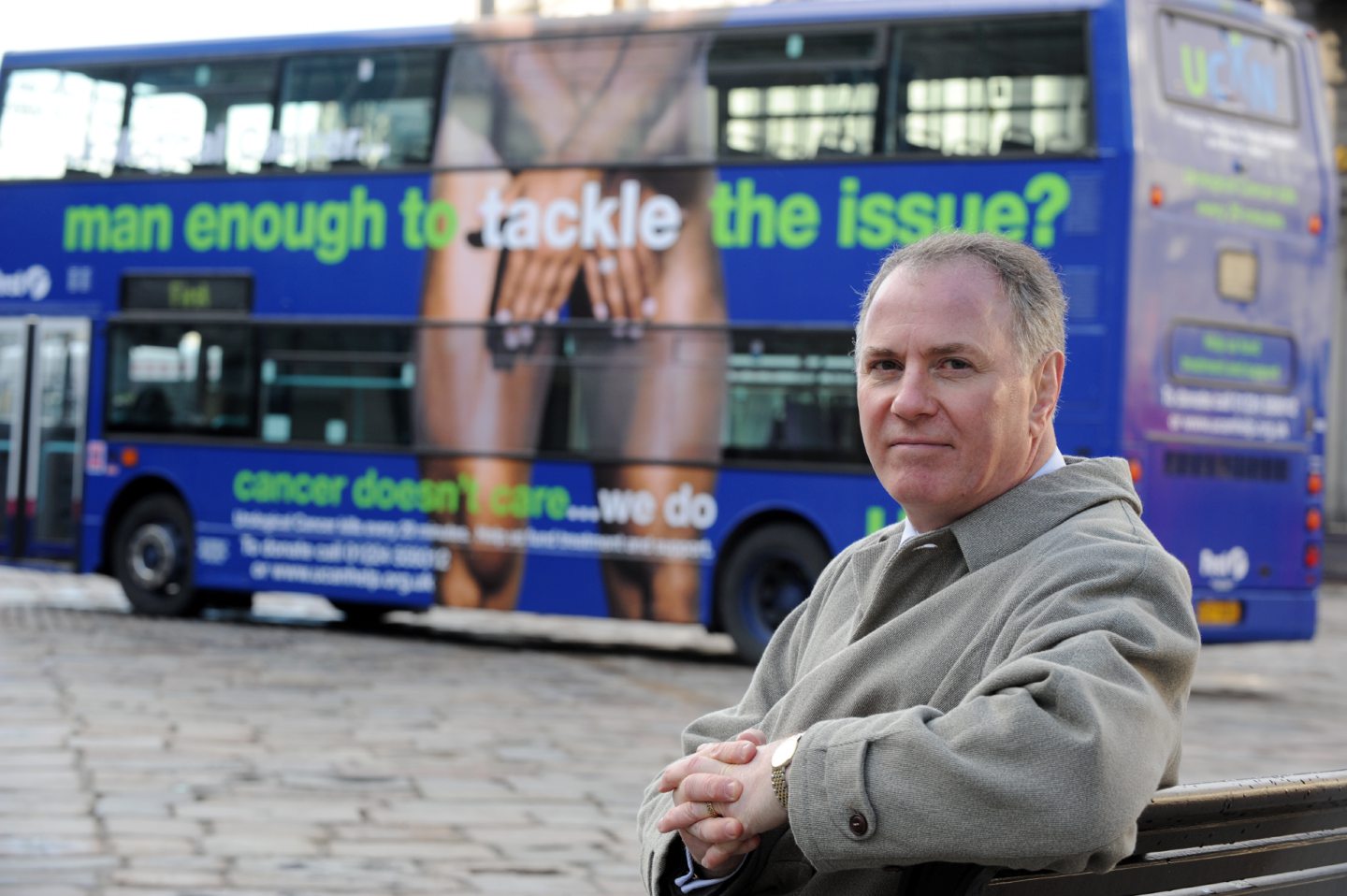 Ucan's chairman at the time, Sam McClinton, in front of the attention-grabbing bus. Image: Jenny Hill/ DC Thomson
