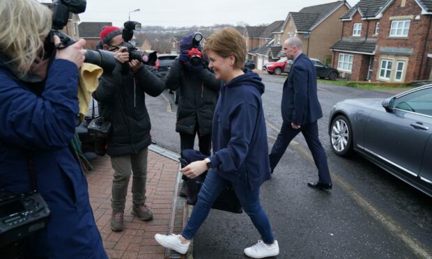 First Minister Nicola Sturgeon arrives at her home in Glasgow after announcing that she will stand down. Image: Andrew Milligan/PA Wire.