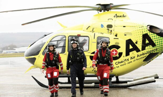 SCAA crew walking out of helicopter