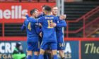 Mitch Megginson is congratulated by his Cove Rangers team-mates after scoring against Partick Thistle. Image: Dave Cowe