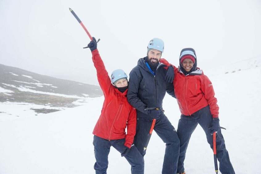 Emma Willis, Rylan Clark and Oti Mabuse standing in the snow on their Cairngorm Mountain challenge for Red Nose Day which has been halted due to 100mph winds