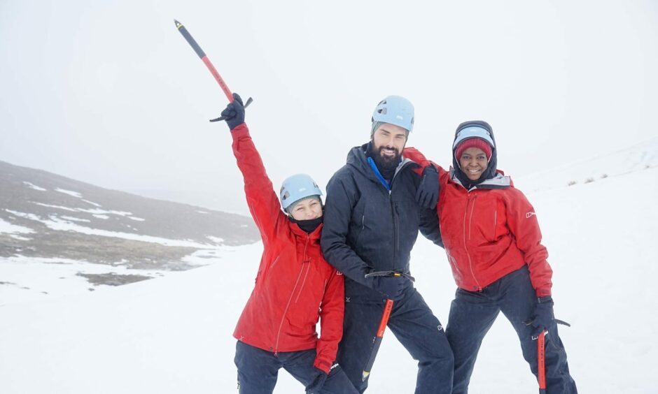 Emma Willis, Rylan Clark and Oti Mabuse celebrating in the snow on Cairngorm Mountain