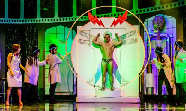 Actors onstage during a production of The Rocky Horror Show