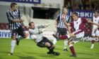 Elgin City's Steven Dunn in action in a 4-0 defeat against Hearts in the League Cup in 2010. Image: SNS