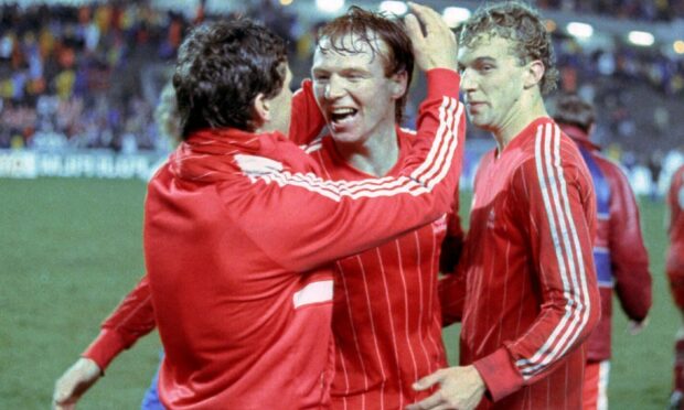 Alex McLeish (centre) celebrates the European Cup Winners' Cup Final win with Eric Black (left) and Neale Cooper. Image: SNS.