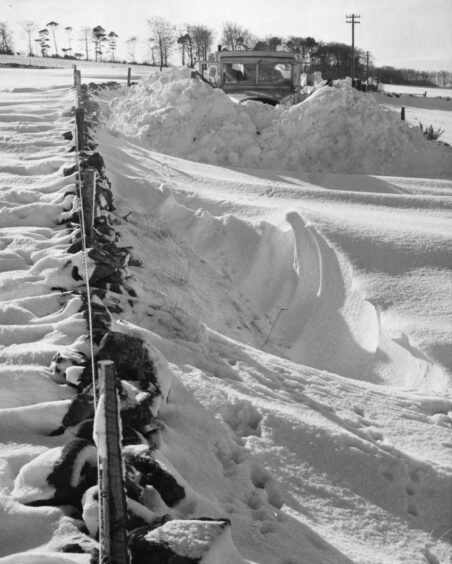 A snow plough takes on some challenging drifts in February 1969.