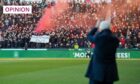Former Aberdeen FC manager Jim Goodwin applauds fans as they unveil a 'Goodwin out' banner (Image: Vagelis Georgariou/Action Plus/Shutterstock)