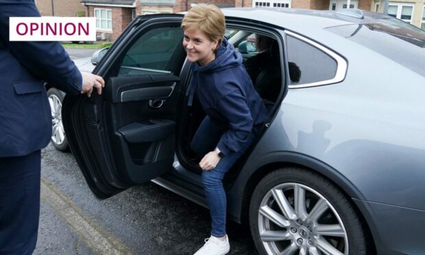 Nicola Sturgeon heads home after announcing her plans to soon step down as first minister (Image: Andrew Milligan/PA)