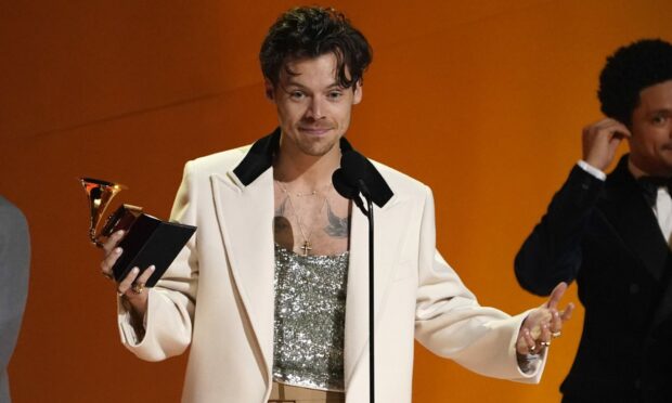 Harry Styles accepts the award for album of the year for "Harry's House" at the 65th annual Grammy Awards. Image: AP Photo/Chris Pizzello.