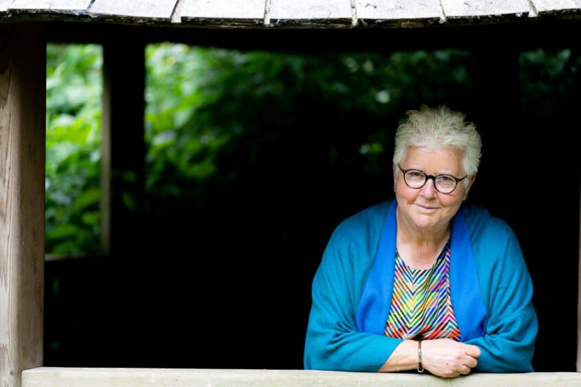 Val McDermid posed and looking directly into the camera. 