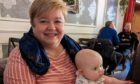 Yvonne Wright (with her granddaughter) will step down from her role as a trustee with Home-Start Aberdeen this spring, after dedicating 21 years to helping the charity. Image: Home-Start Aberdeen