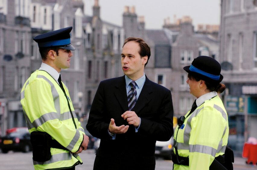 Lib Dem Martin Greig speaks to community wardens - a forerunner to the city wardens - in Torry in 2004. Image: Simon Walton/DC Thomson.