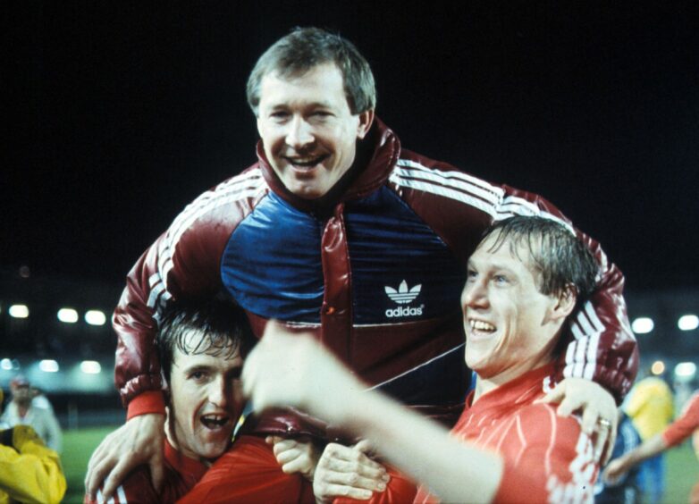 Aberdeen Boss Alex Ferguson is held high by his players after the European Cup Winners' Cup final. Image: SNS.
