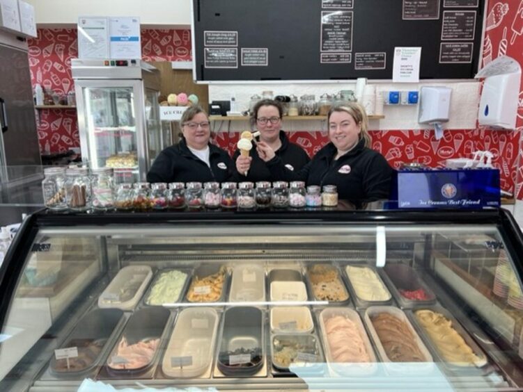 Staff behind the ice cream display case in Shorty's