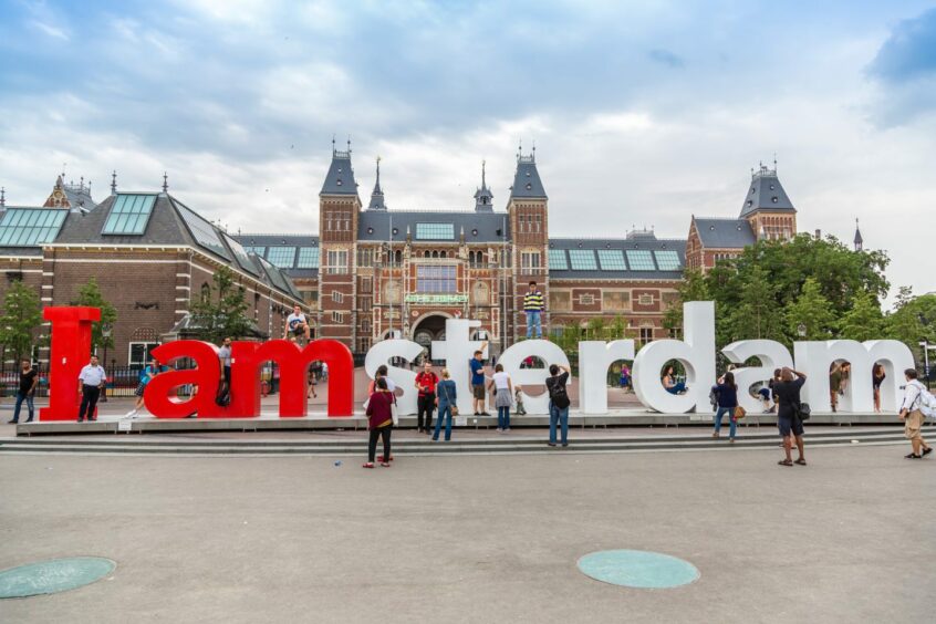 Visitors clamber over the Amsterdam letters outside the Rijksmuseum in the Dutch capital in 2014.