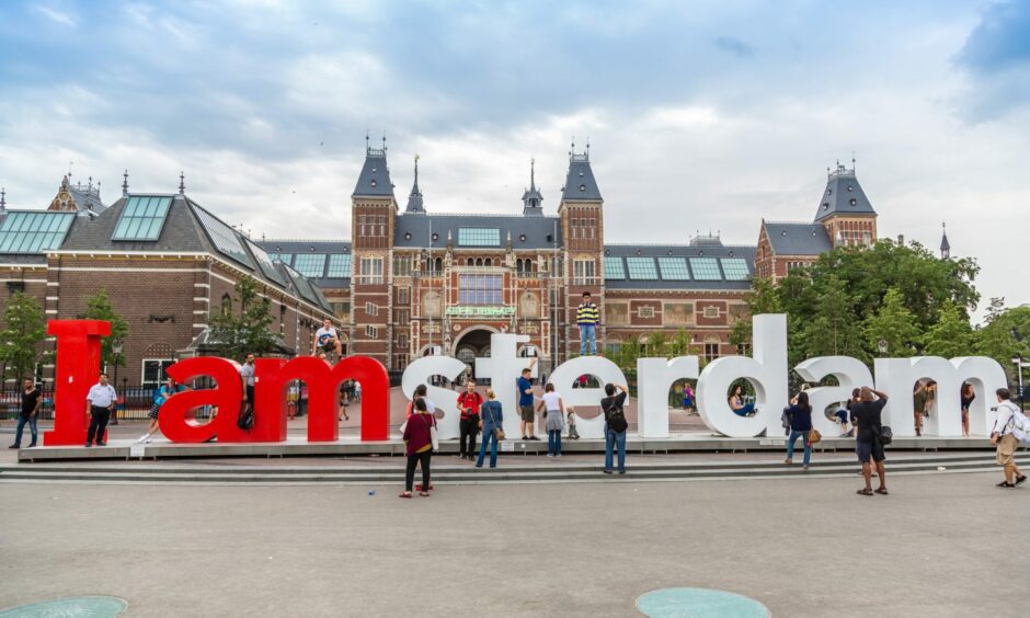 Visitors clamber over the I Amsterdam letters outside the Rijksmuseum in the Dutch capital in 2014